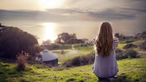 A Girl Looks At The Sunset