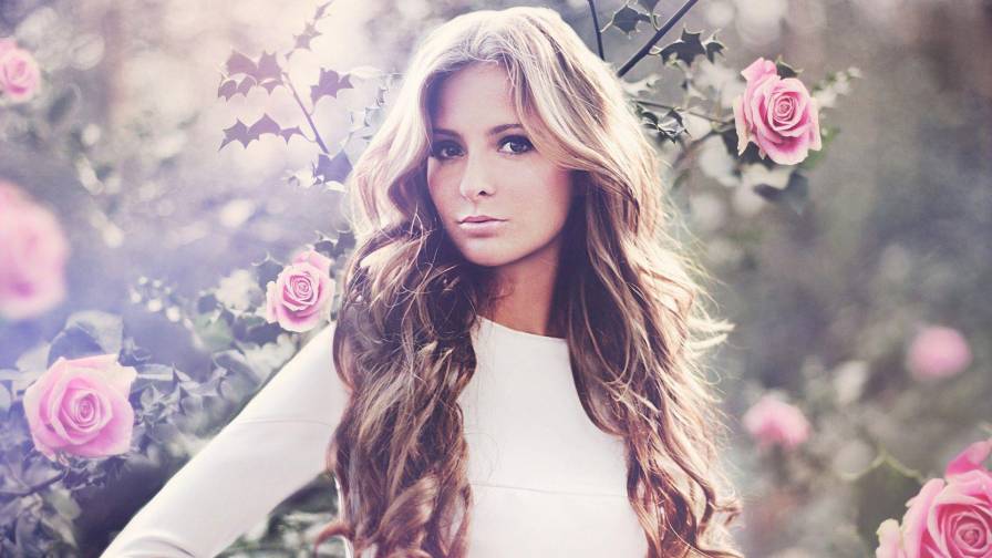 Blonde Next To Roses In Bloom