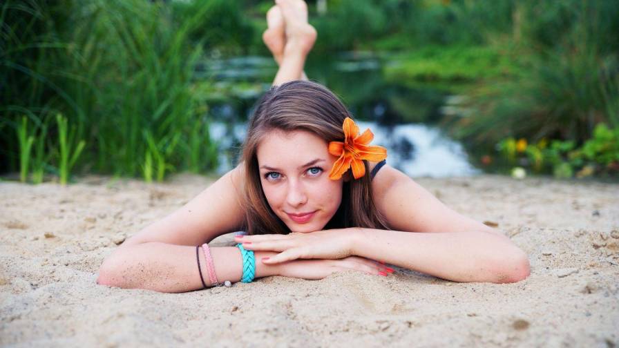 Girl Relaxing In The Sand