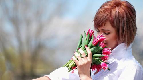 Girl Smelling Tulips