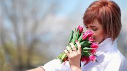 Girl Smelling Tulips